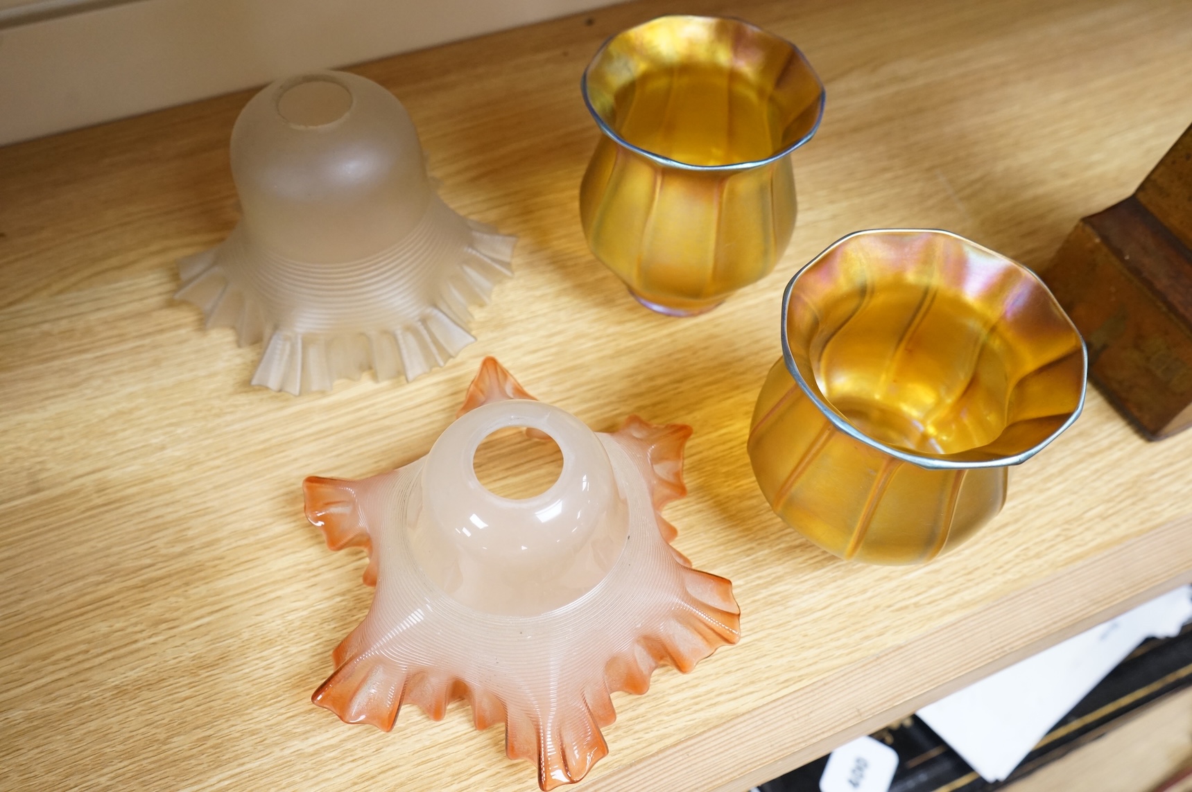A pair of Quezal Art Glass iridescent light shades, and two frilled edged shades, Quezal shades 11.5cm high